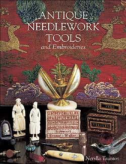 Antique needlework tools and embroideries